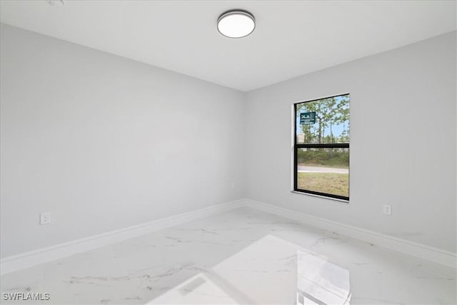 631 Summit Ave S, Lehigh Acres, FL 33974 - unfurnished room featuring baseboards and marble finish floors