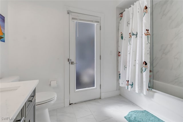 full bathroom featuring vanity, shower / tub combo, toilet, and marble finish floor