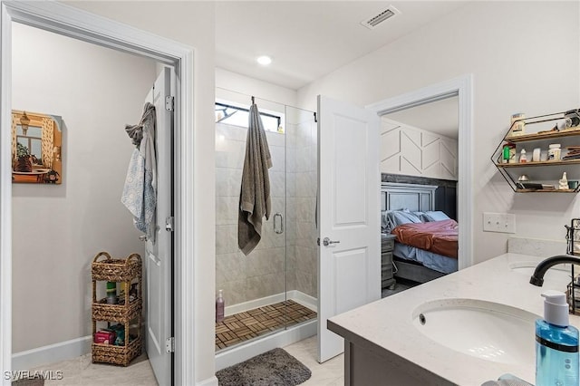 16000 Shoebutton Ct, North Fort Myers, FL 33917 - ensuite bathroom featuring a sink, double vanity, baseboards, a shower stall, and ensuite bathroom