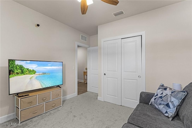 16000 Shoebutton Ct, North Fort Myers, FL 33917 - carpeted living area featuring baseboards, a ceiling fan, and visible vents