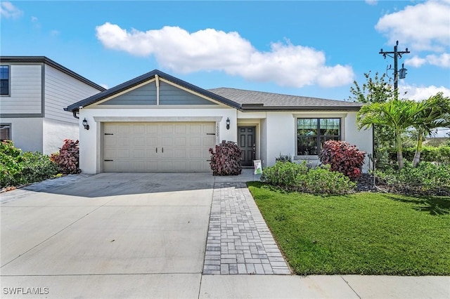 16000 Shoebutton Ct, North Fort Myers, FL 33917 - single story home featuring a garage, a front lawn, stucco siding, and concrete driveway