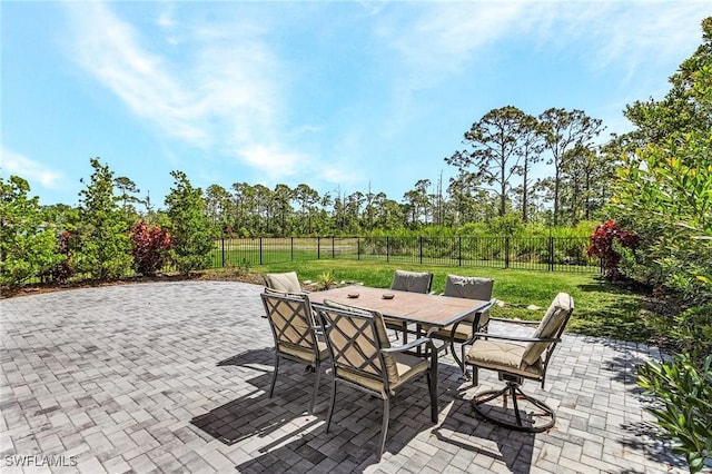 16000 Shoebutton Ct, North Fort Myers, FL 33917 - view of patio / terrace with a fenced backyard and outdoor dining space