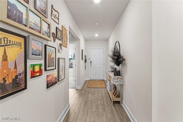 16000 Shoebutton Ct, North Fort Myers, FL 33917 - hall with recessed lighting, baseboards, and wood finished floors