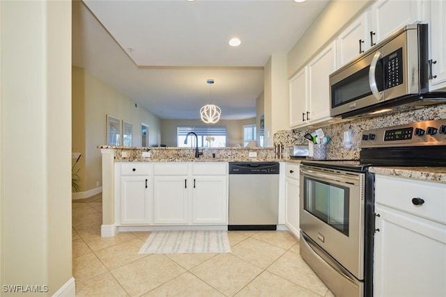 kitchen with white cabinets, a sink, stainless steel appliances, a peninsula, and light tile patterned floors