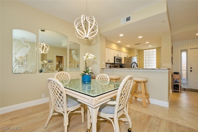 dining room featuring recessed lighting, baseboards, visible vents, and an inviting chandelier