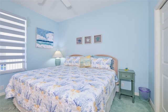 bedroom featuring carpet floors, baseboards, and ceiling fan