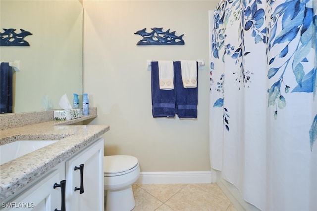 bathroom with a shower with curtain, tile patterned flooring, vanity, baseboards, and toilet