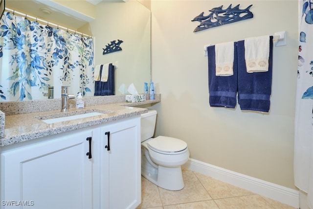 full bath featuring vanity, baseboards, tile patterned floors, and toilet