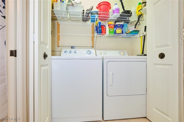 laundry area with laundry area and washer and clothes dryer