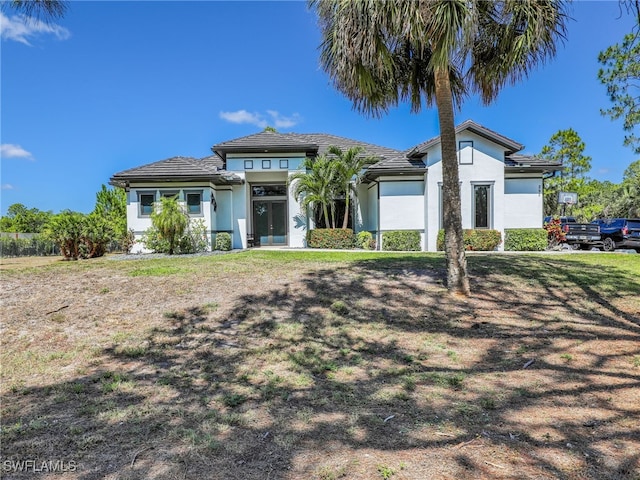 view of front of property featuring french doors and stucco siding