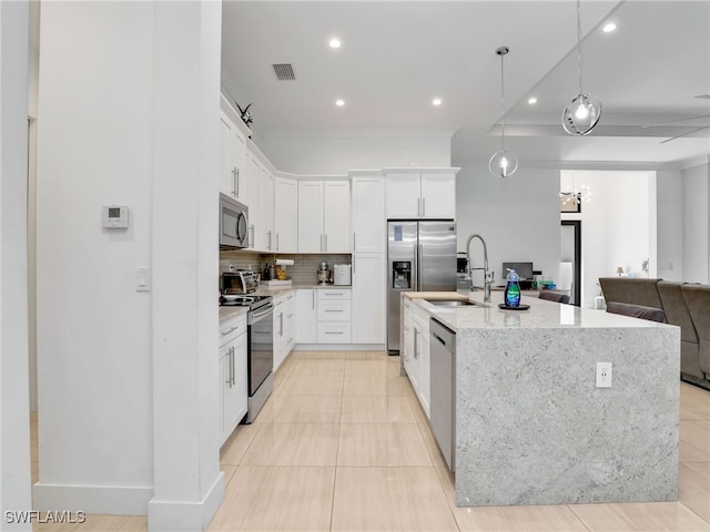 kitchen with backsplash, visible vents, appliances with stainless steel finishes, a sink, and recessed lighting