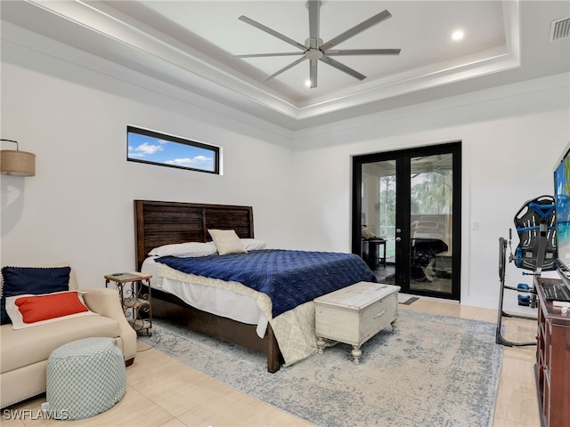bedroom with a ceiling fan, visible vents, a raised ceiling, access to outside, and recessed lighting