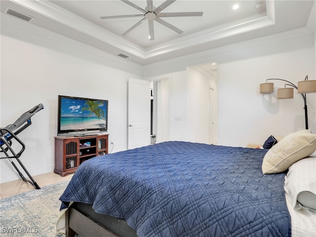 tiled bedroom featuring visible vents, recessed lighting, a ceiling fan, and a tray ceiling