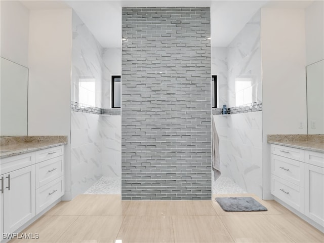 full bathroom featuring vanity and a walk in shower