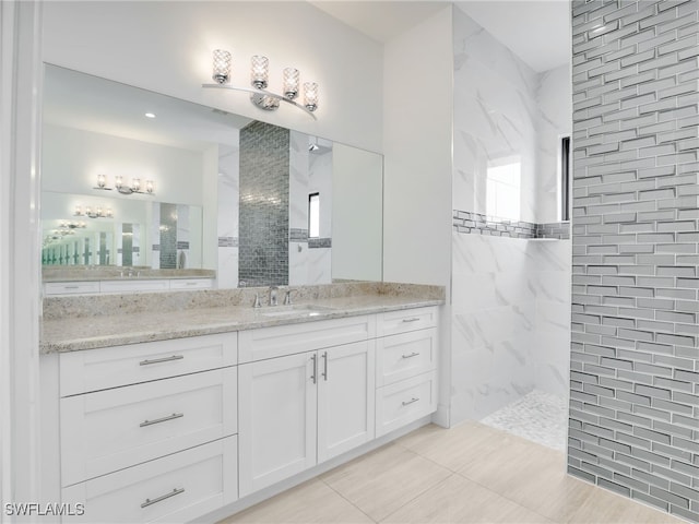 bathroom featuring vanity, walk in shower, and tile patterned floors