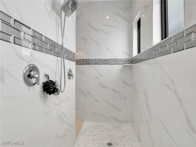 full bathroom with a tile shower