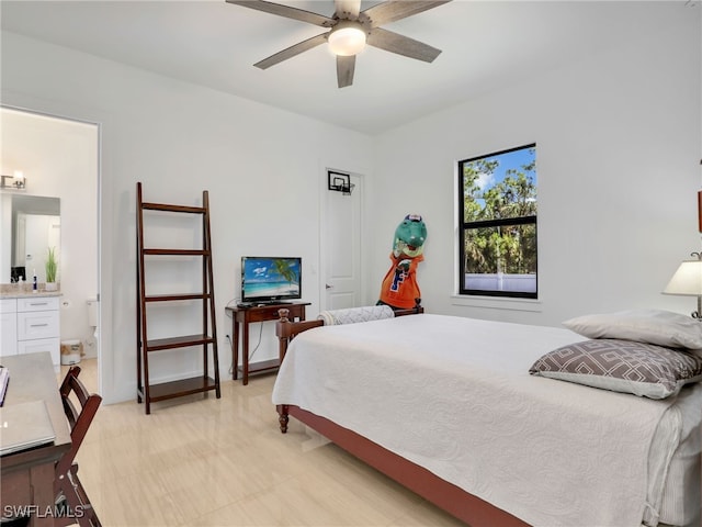 bedroom featuring ensuite bathroom and a ceiling fan