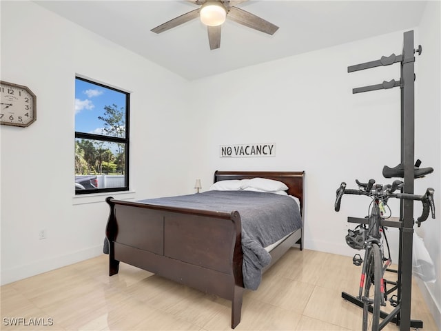 bedroom featuring baseboards and a ceiling fan