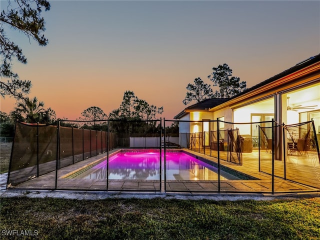 view of sport court with a fenced in pool and a fenced backyard