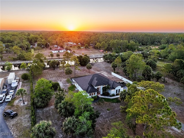 drone / aerial view with a view of trees