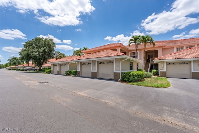 8115 Celeste Dr Unit 6110, Naples, FL 34113 - mediterranean / spanish-style house featuring a tile roof and stucco siding