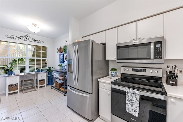 8115 Celeste Dr Unit 6110, Naples, FL 34113 - kitchen featuring light countertops, white cabinetry, appliances with stainless steel finishes, and light tile patterned floors