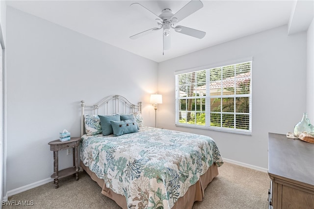 8115 Celeste Dr Unit 6110, Naples, FL 34113 - bedroom with baseboards, a ceiling fan, and carpet
