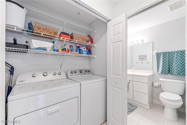 8115 Celeste Dr Unit 6110, Naples, FL 34113 - laundry room featuring light tile patterned floors, laundry area, independent washer and dryer, and visible vents