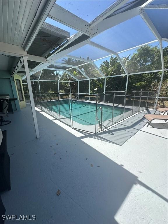 1209 SW 36th Ter, Cape Coral, FL 33914 - swimming pool featuring a patio area and a lanai