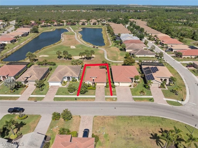 aerial view featuring a water view and a residential view