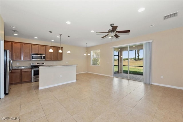 kitchen featuring appliances with stainless steel finishes, recessed lighting, baseboards, open floor plan, and visible vents