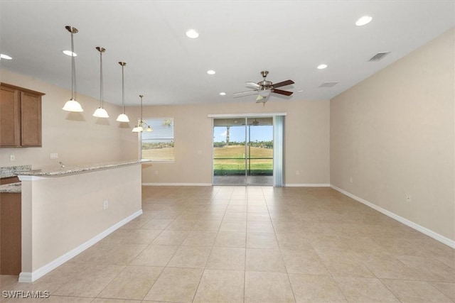 interior space with ceiling fan, visible vents, light tile patterned floors, baseboards, and recessed lighting