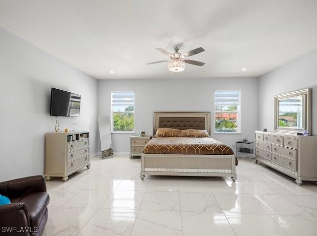 27257 Pinecrest Ln, Bonita Springs, FL 34135 - bedroom with baseboards, recessed lighting, marble finish floor, and a ceiling fan