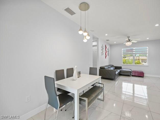 27257 Pinecrest Ln, Bonita Springs, FL 34135 - dining space with ceiling fan, marble finish floor, recessed lighting, baseboards, and visible vents