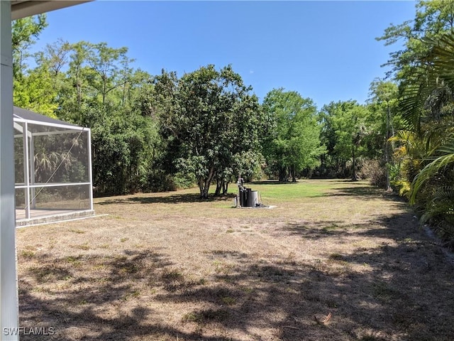 view of yard with a lanai