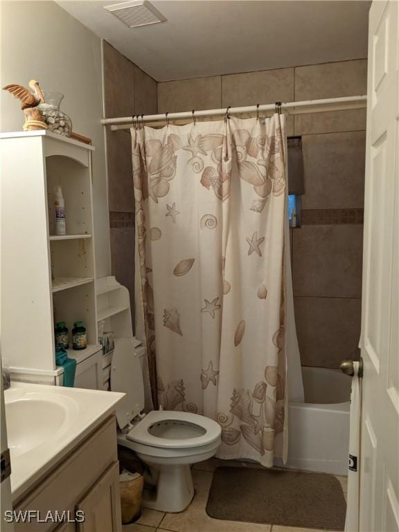 full bathroom featuring visible vents, tile patterned flooring, vanity, toilet, and shower / tub combo with curtain