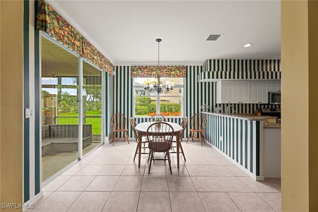12541 Allendale Cir, Fort Myers, FL 33912 - dining area with an inviting chandelier, light tile patterned floors, and visible vents