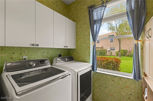 12541 Allendale Cir, Fort Myers, FL 33912 - laundry room with separate washer and dryer, wallpapered walls, and cabinet space