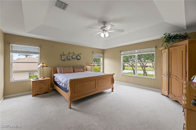 12541 Allendale Cir, Fort Myers, FL 33912 - bedroom featuring a ceiling fan, baseboards, visible vents, a raised ceiling, and light carpet