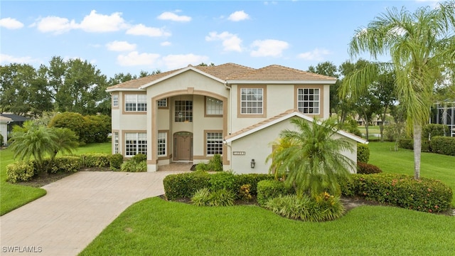 12541 Allendale Cir, Fort Myers, FL 33912 - mediterranean / spanish-style house featuring a front yard and stucco siding