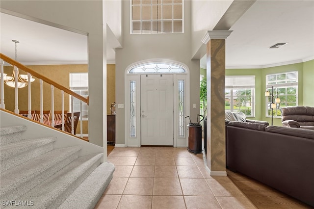 12541 Allendale Cir, Fort Myers, FL 33912 - foyer with stairs, ornamental molding, light tile patterned flooring, visible vents, and baseboards
