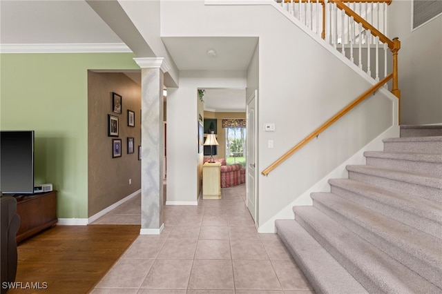 12541 Allendale Cir, Fort Myers, FL 33912 - foyer with crown molding, light tile patterned floors, stairway, and baseboards