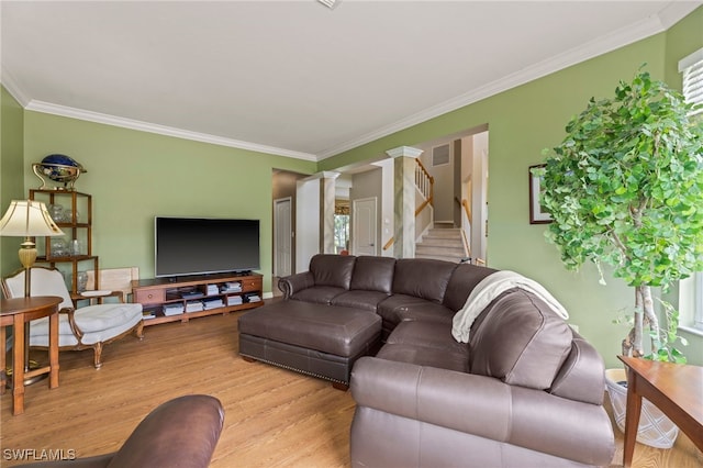 12541 Allendale Cir, Fort Myers, FL 33912 - living area with decorative columns, visible vents, stairway, crown molding, and light wood-style flooring