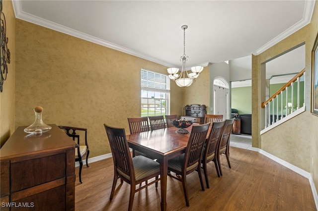 12541 Allendale Cir, Fort Myers, FL 33912 - dining room with baseboards, ornamental molding, a chandelier, and wood finished floors
