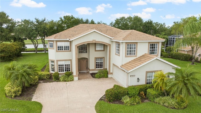 12541 Allendale Cir, Fort Myers, FL 33912 - view of front of house with a garage, stucco siding, and driveway