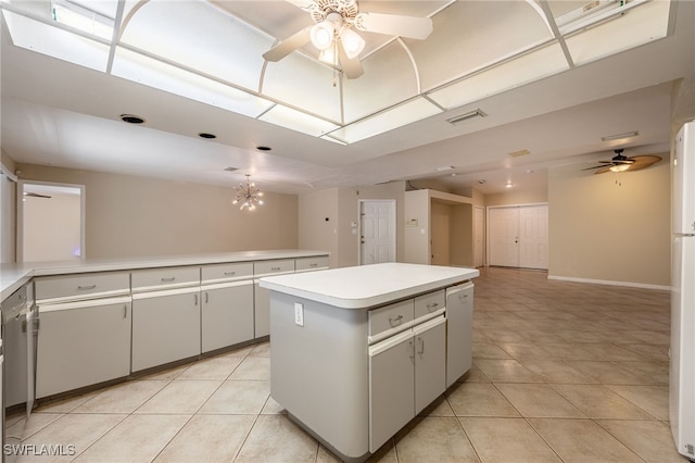 kitchen featuring visible vents, light countertops, ceiling fan with notable chandelier, and light tile patterned floors