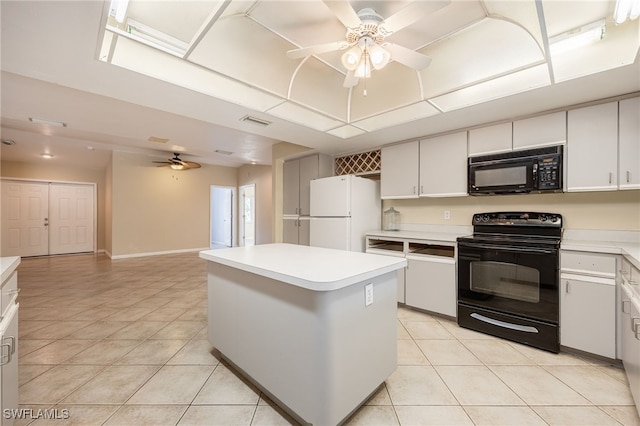 kitchen featuring a kitchen island, ceiling fan, light tile patterned floors, and black appliances