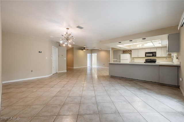 unfurnished living room featuring visible vents, light tile patterned floors, baseboards, a sink, and ceiling fan with notable chandelier