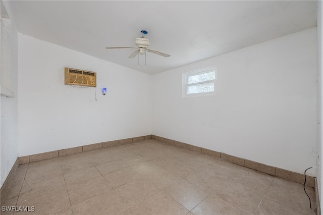 unfurnished room with baseboards, ceiling fan, and a wall mounted air conditioner