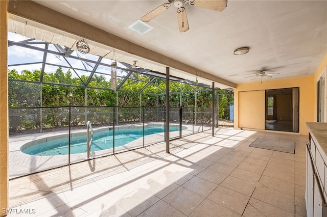 pool with a ceiling fan, a patio area, and a lanai